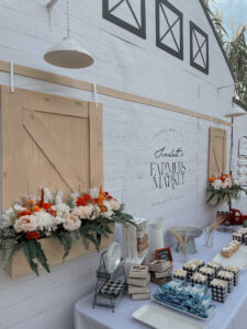 Food table backdrop of a personalized Farmers Market  storefront at a farmers market first birthday party!